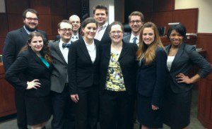 Pictured are (front row, l-r) Sara Page, Robert Martin, Rachel Hogan, Prof. Amy Moore, Emily Cole, and Ardath Griffin; (back row, l-r) Dayne Geyer, Ron Laffitte, Atty. Andrew Caple-Shaw and Patrick Ober.