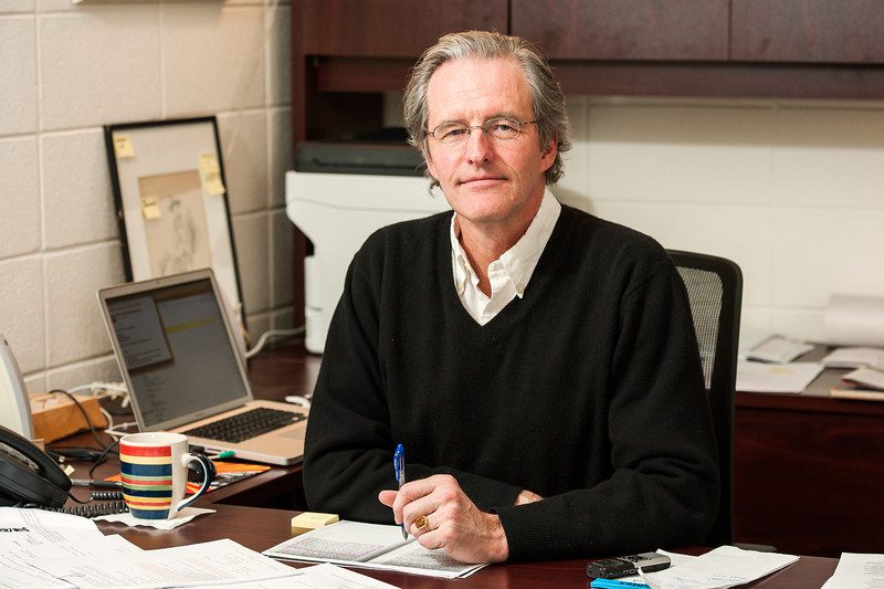 Associate Professor William A. Akers, Chair of the Motion Pictures program, at his desk