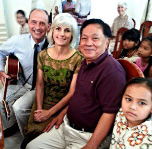 Taplin pictured here with her husband, Chaz, and Cambodian leaders.