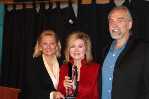 Congressman Marsha Blackburn (center) receives the award from Cecil Scaife's daughter LaRawn Scaife Rhea and his son producer Joe Scaife.