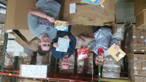 Students sorting books by subject and age level at Books for Africa