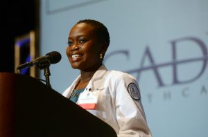 Evelyn Kisayke speaks at the induction ceremony.