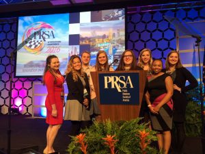 Student attendees pose on the award ceremony's stage.