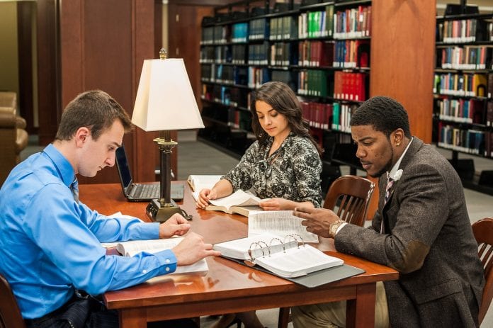 Law students studying in library 2015