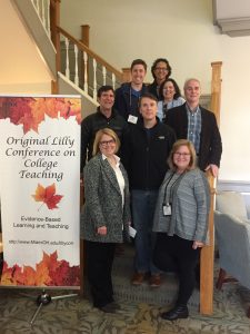 Several Belmont faculty standing by the Lilly Conference on College Teaching Sign