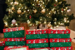 Boxes sit in front of the Foutch Alumni House Christmas Tree.