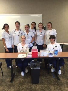 Students participating at a vaccine clinic in Belmont's neighborhood.