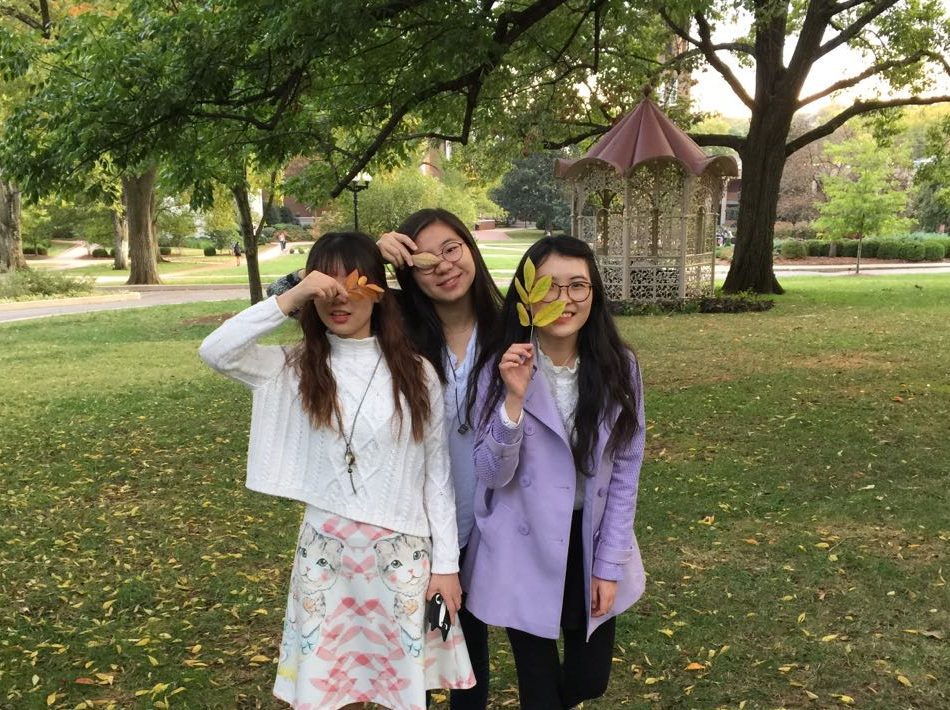 Three of the Chinese exchange students standing on Belmont's quad