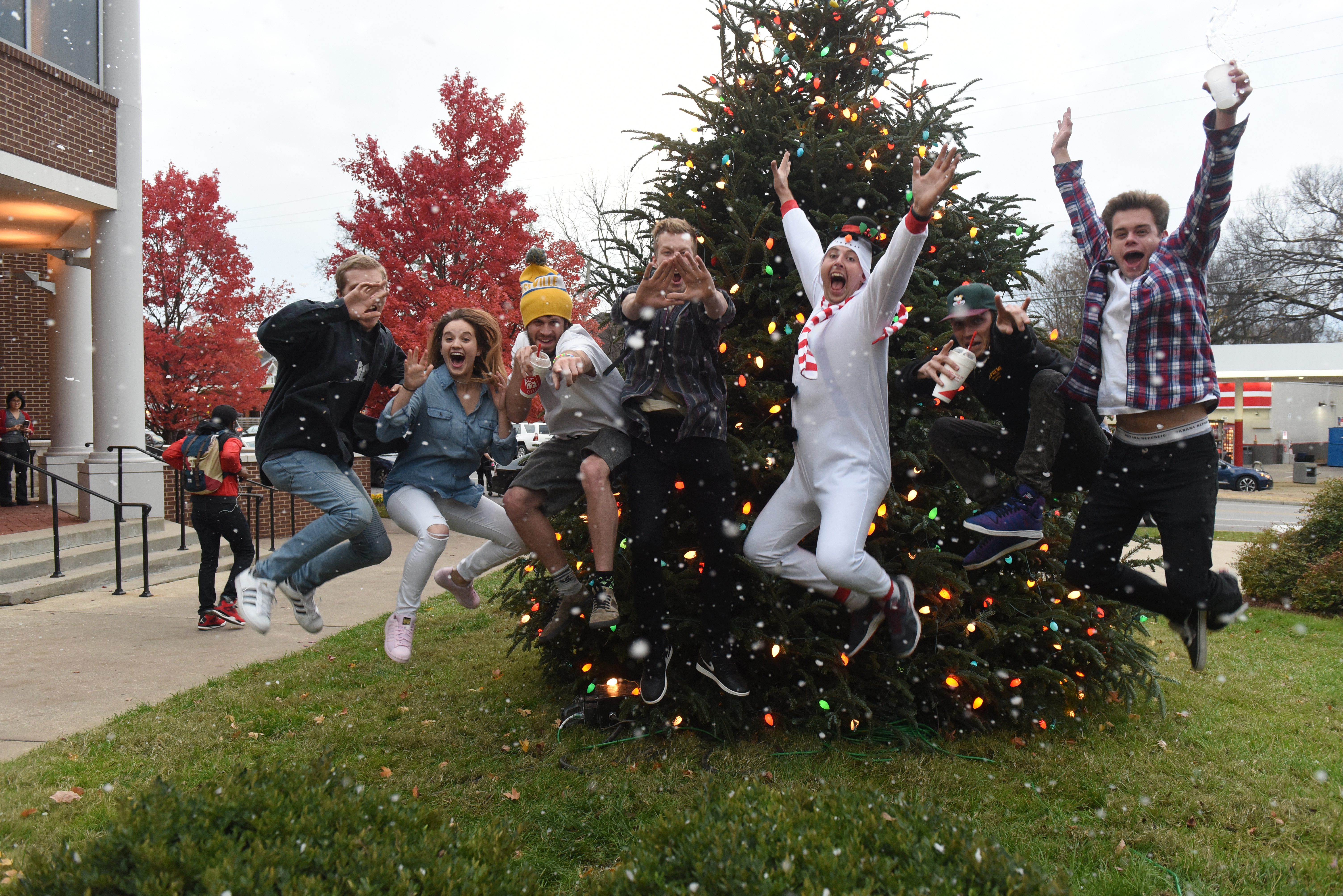 Students jump in front of the Christmas Tree at Blizzard on the Blvd.