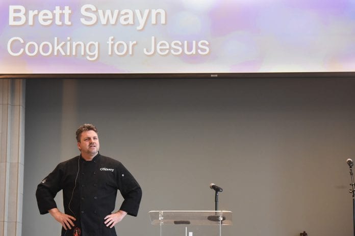Brett Swayn speaks to students at chapel