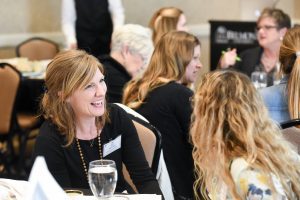 Attendees discuss material at the ACE Stakeholder Summit