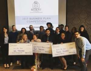 Winners of the Business Plan Competition hold their prizes