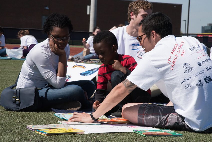 Students read to children on Family Literacy Day