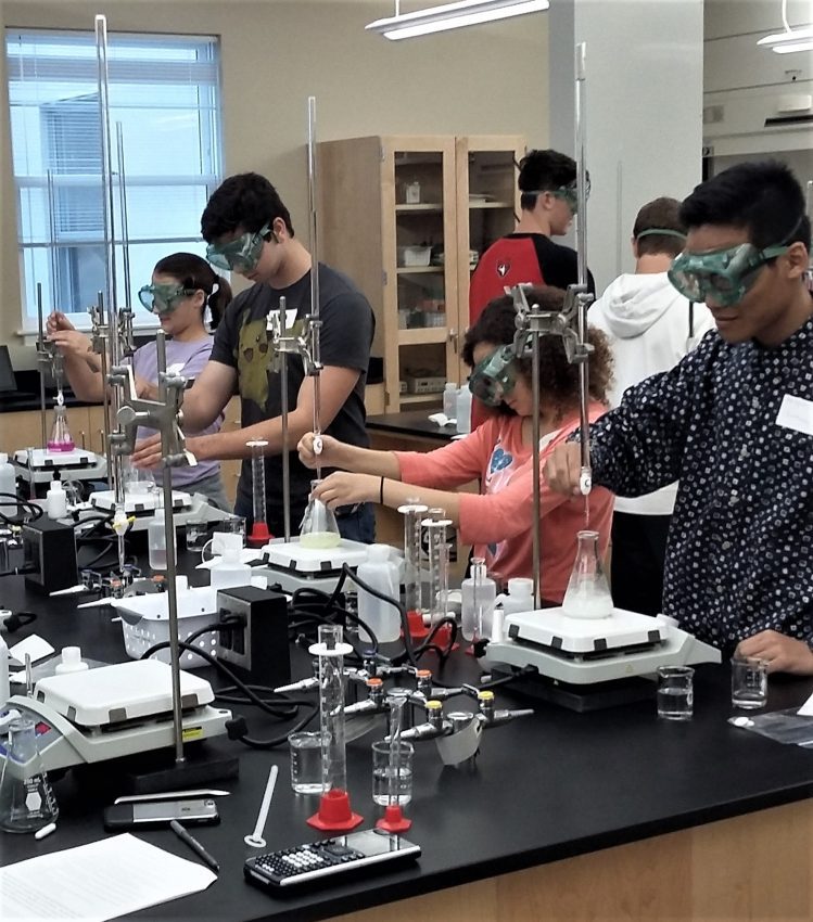 Local high school students participate in a lab at Belmont