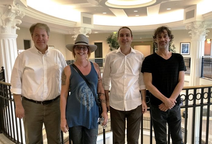 The photo shows L-R CSM dean Dr. Thom Spence, Dean of the College of Sciences & Mathematics, Paula Fairfield, Dr. Scott Hawley, Physics professor, and Rob McClain, owner of OmegaLab studio and former Belmont student.