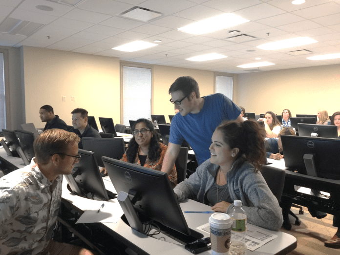 Students participating in SAP-simulated group project represent four disciplines from across campus