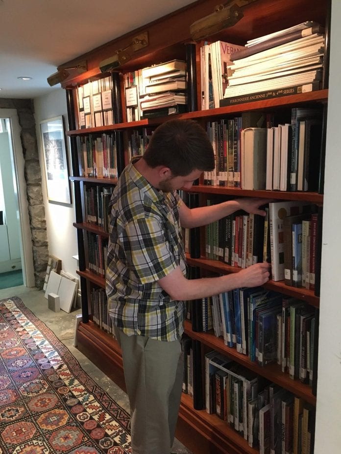 A Belmont librarian volunteers his time at a local library.