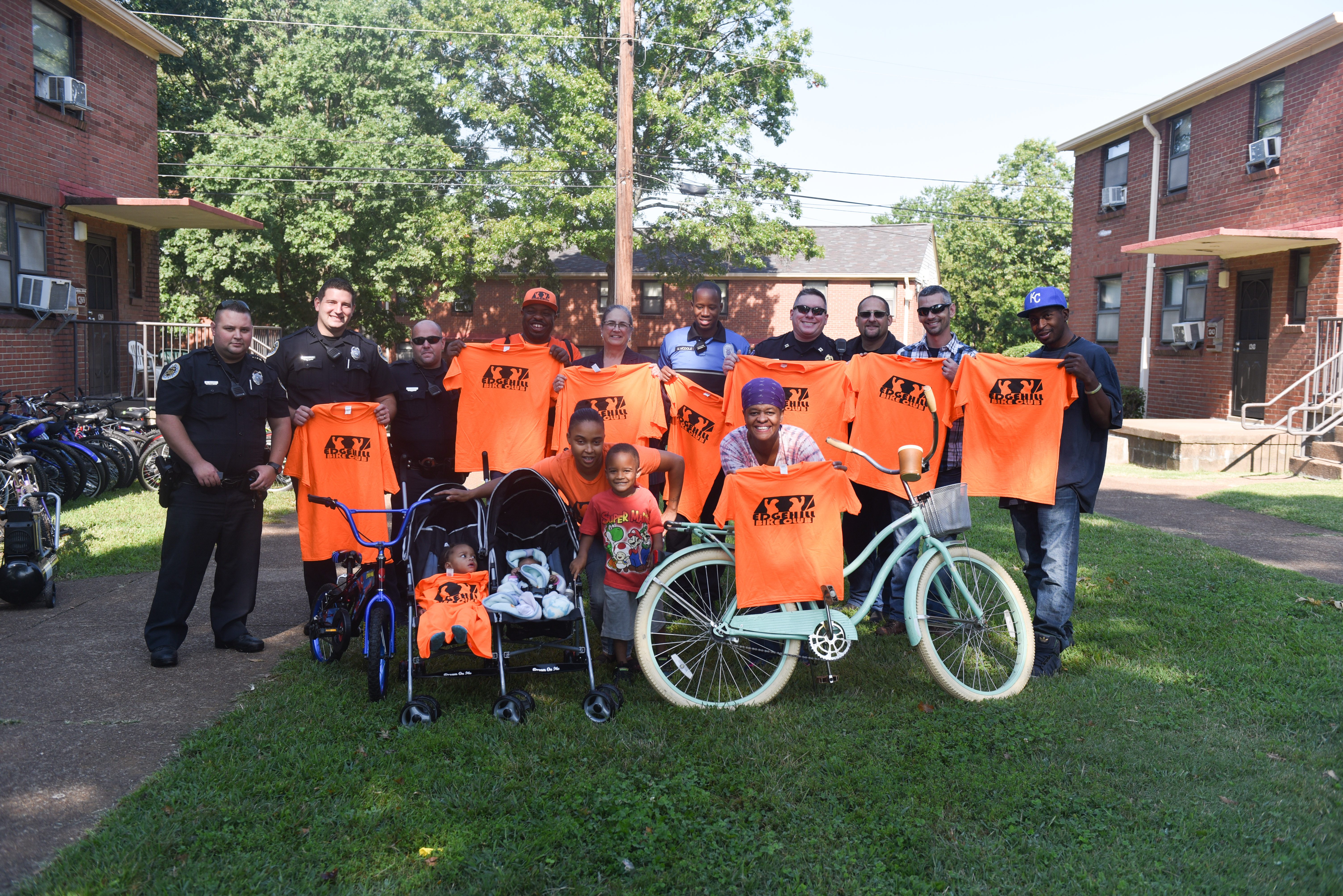 Belmont security officers donate bicycles to members of the Edgehill Bike Club