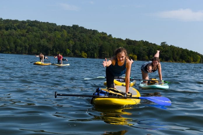 Student do paddle board yoga at the lake at Belmont University in Nashville, Tenn. September 9, 2017.