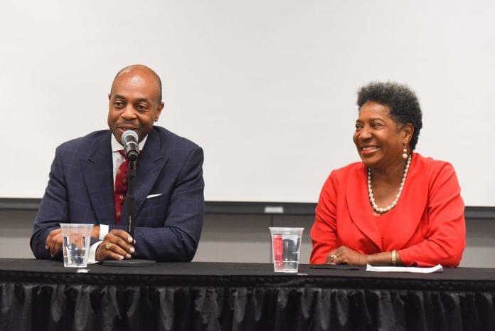 Tennessee Rep. Brenda Gilmore and Rep. Harold Love sitting at a table smiling and answering a question
