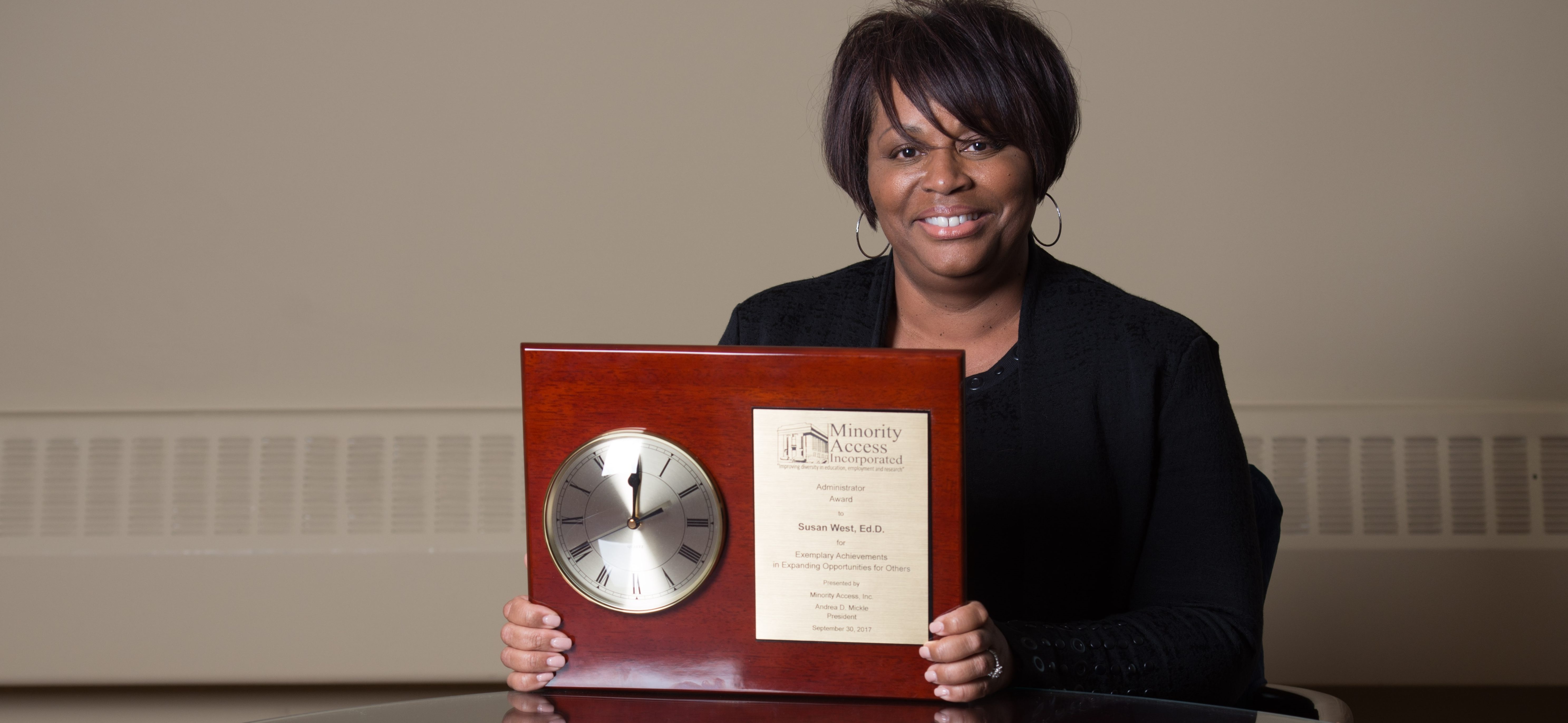 Dr. West and her award from Minority Access, Inc.