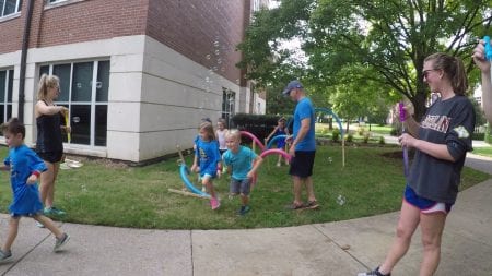 Kids who participated in the event run towards their activities. 