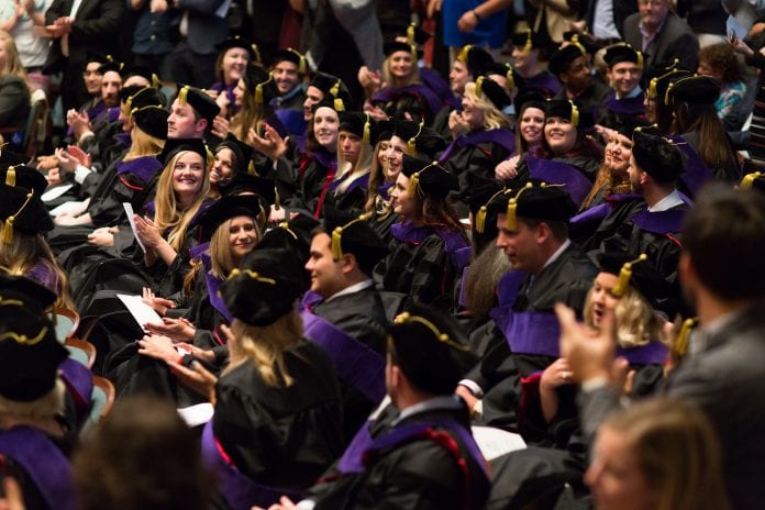 Belmont law students sit in the crowd during their hooding ceremony.