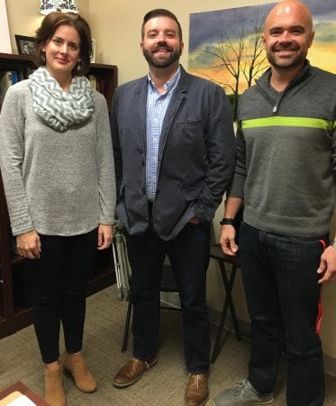 A photo, taken in a Belmont faculty member's office, of Drs. Vaughn, Webb and Fyke