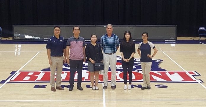 Staff members meet with the Belmont Athletics Team.