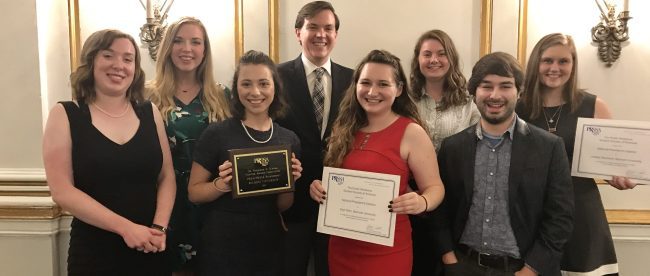 Executive members of PRSSA holding their awards