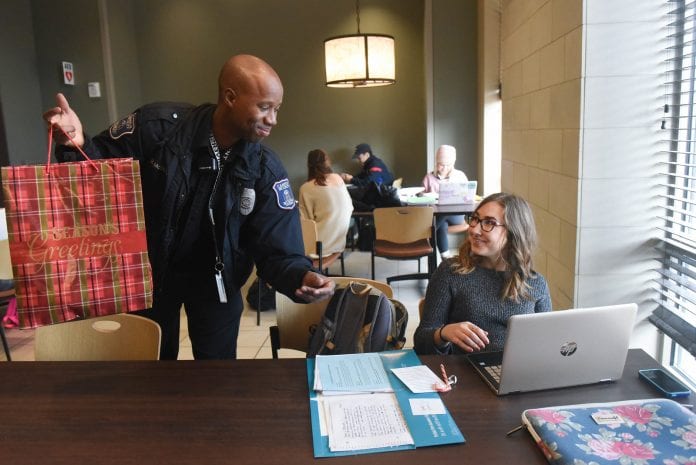 Malcolm McDole of Belmont security hands out Christmas cheer at Belmont University in Nashville, Tennessee, December 7, 2017.