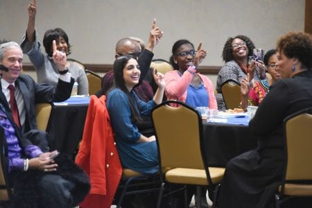 Students, faculty and staff listen to DeVon Franklin and raise their finger to remember the 'one' that's most important.