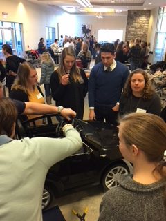 Students work on the ride-along cars.