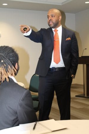 Dr. Thurman Webb, speaking and pointing his hand at the crowd