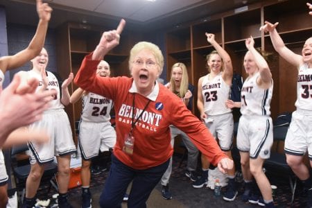 Betty Wiseman cheers with the women's basketball players. 