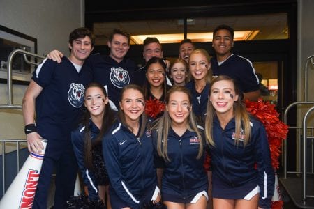 Cheerleaders pose for a picture outside the team's hotel