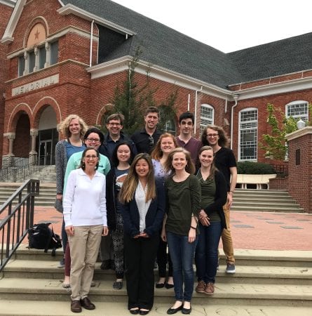 Students and faculty who attended the conference pose for a photo.