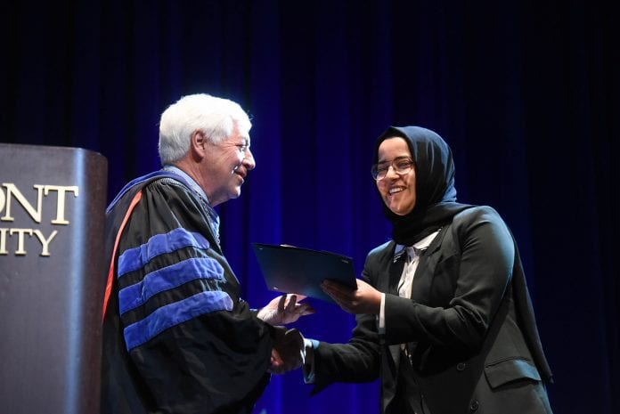 Khadija Ali Amghaiab accepts the Fourth Year Leadership Award