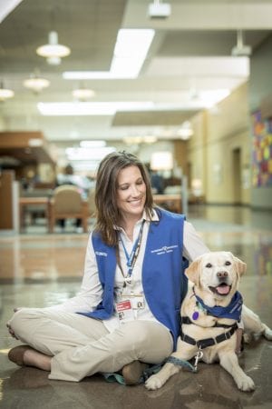 Volunteer Christi Williams and her dog Layla prepare to visit patients at 100 Oaks.(John Russell/Vanderbilt University)