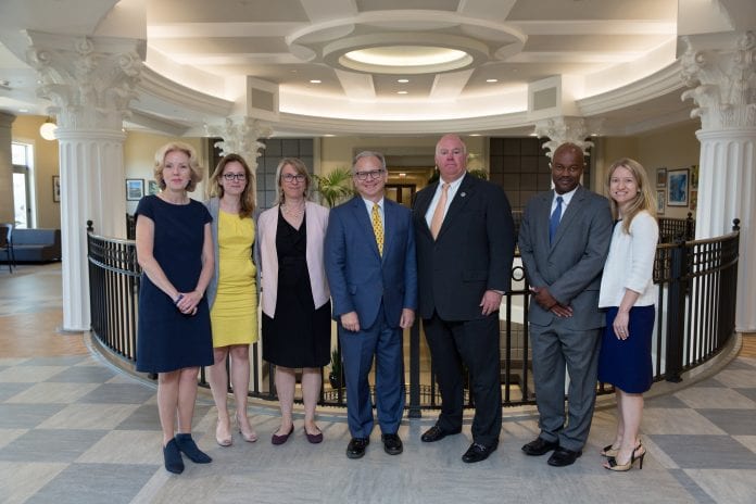 Mayor David Briley and other speakers from the Business Assistance Symposium pose in the Janet Ayers Academic Center lobby