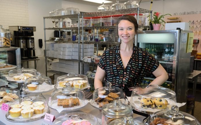Belmont grad Leah Carmean, owner of Baked on 8th bakery, poses in her new store near Belmont University in Nashville, Tennessee, July 31, 2018.
