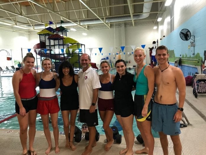 PT and OT students stand in front of the swimming pool at a recent volunteering opportunity with the Nashville Dolphins