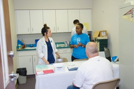 Belmont Pharmacy students help at clinic