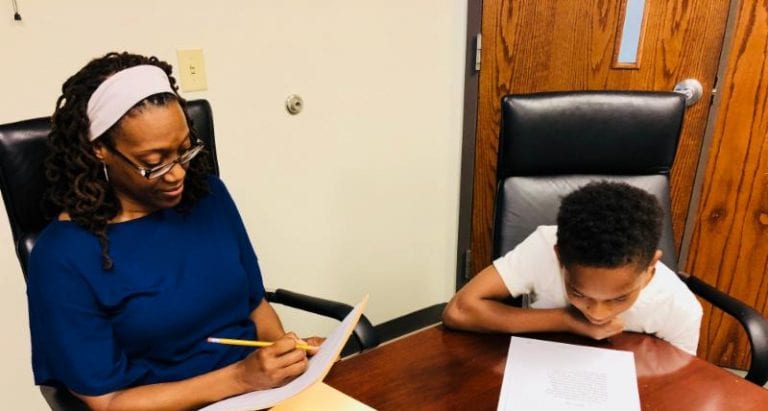 McClain and Students Work with Salama, Increase Local Students’ Reading Capabilities