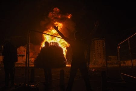 Belmont students watch as the city of Belfast, Northern Ireland experiences the Protestant celebration called OrangeFest, which celebrates the revolution and victory of William of Orange over the Catholic King by lighting huge bonfires the night before all day parades.