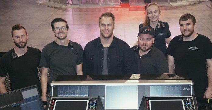 Belmont Alumni pose with tour equipment on the Thomas Rhett tour.