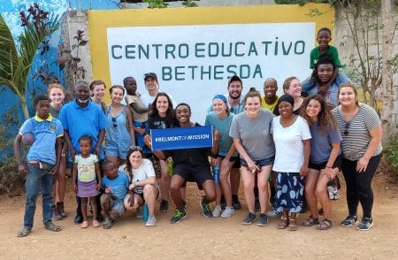 Belmont University students pose with kids in the Dominican Republic