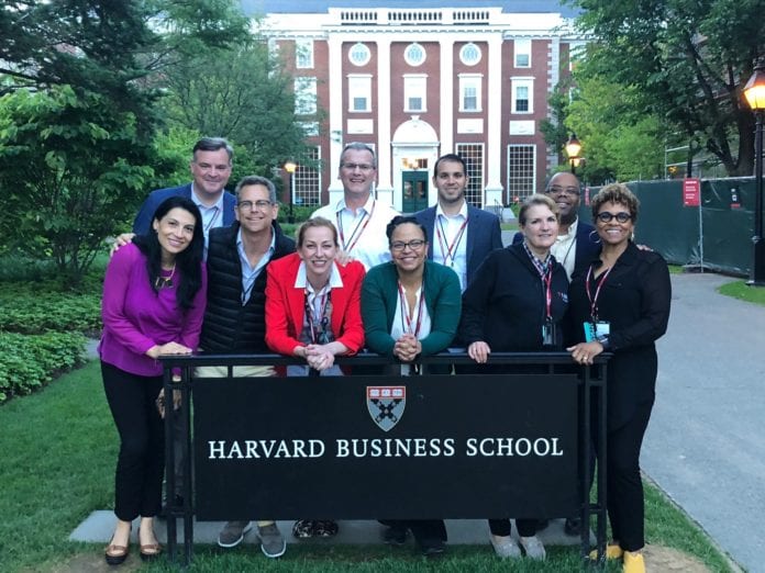 Harvard Business School - Joyce and Harry Group Photo in front of Harvard Business School Sign