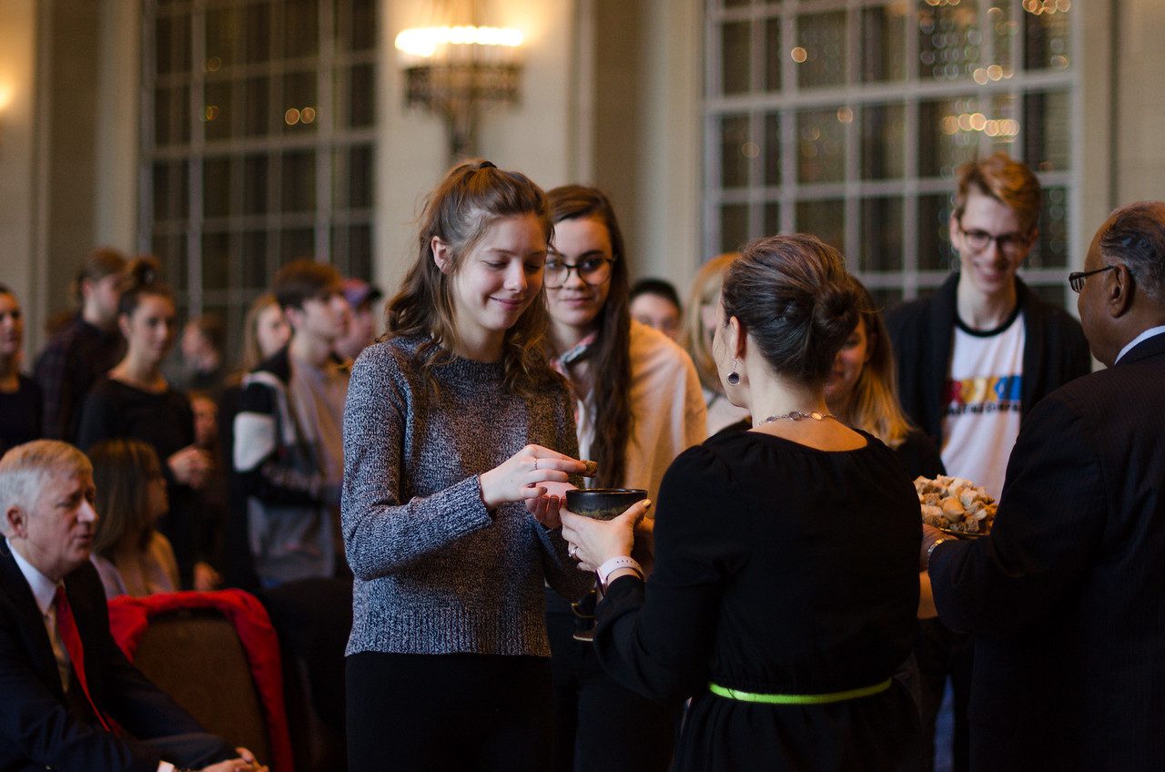 Belmont student takes communion at a campus Chapel service.