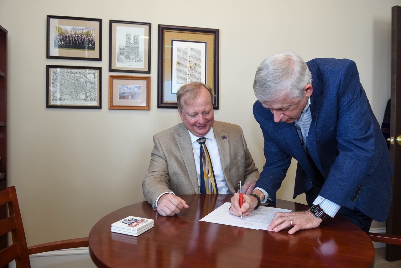 Stone and Gwaltney sign the Transition Agreement